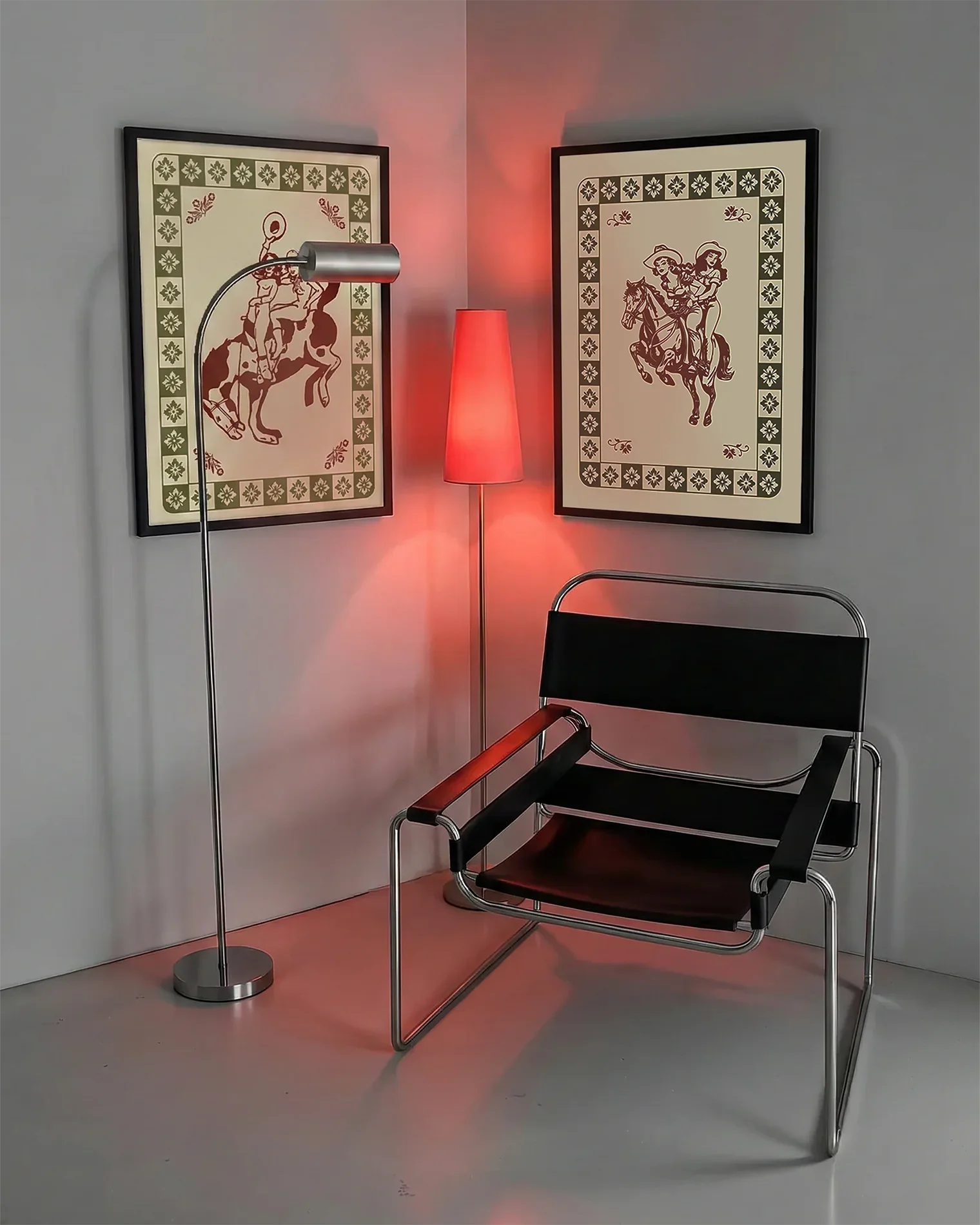 A gallery wall with several framed, queer posters in a living room.