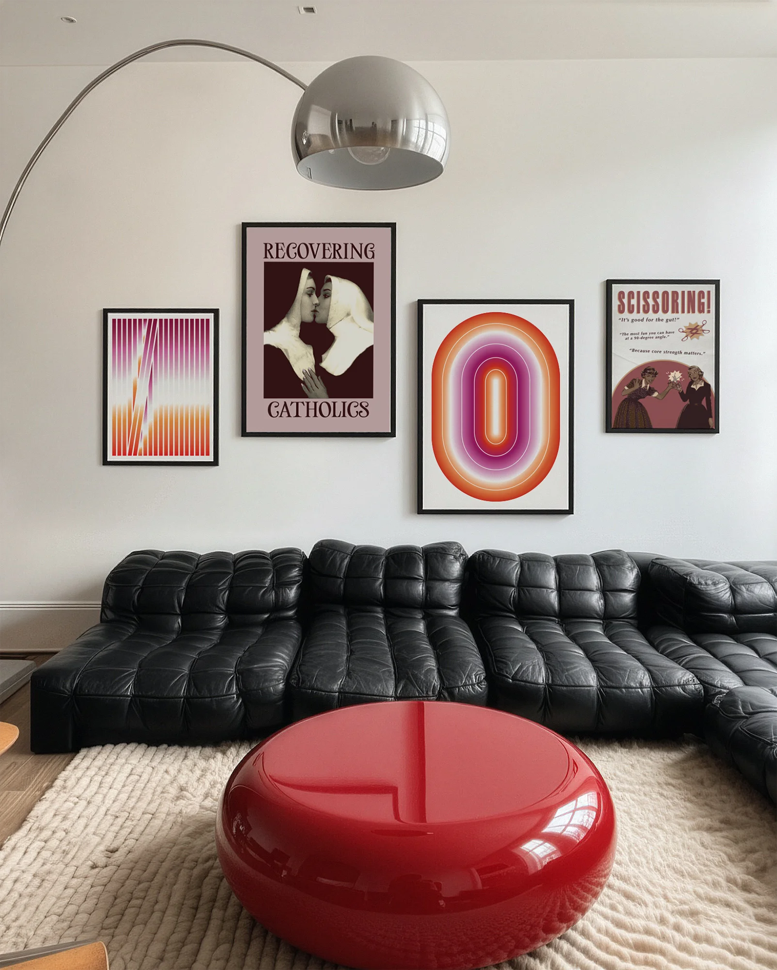 A gallery wall with several framed, queer posters in a living room.