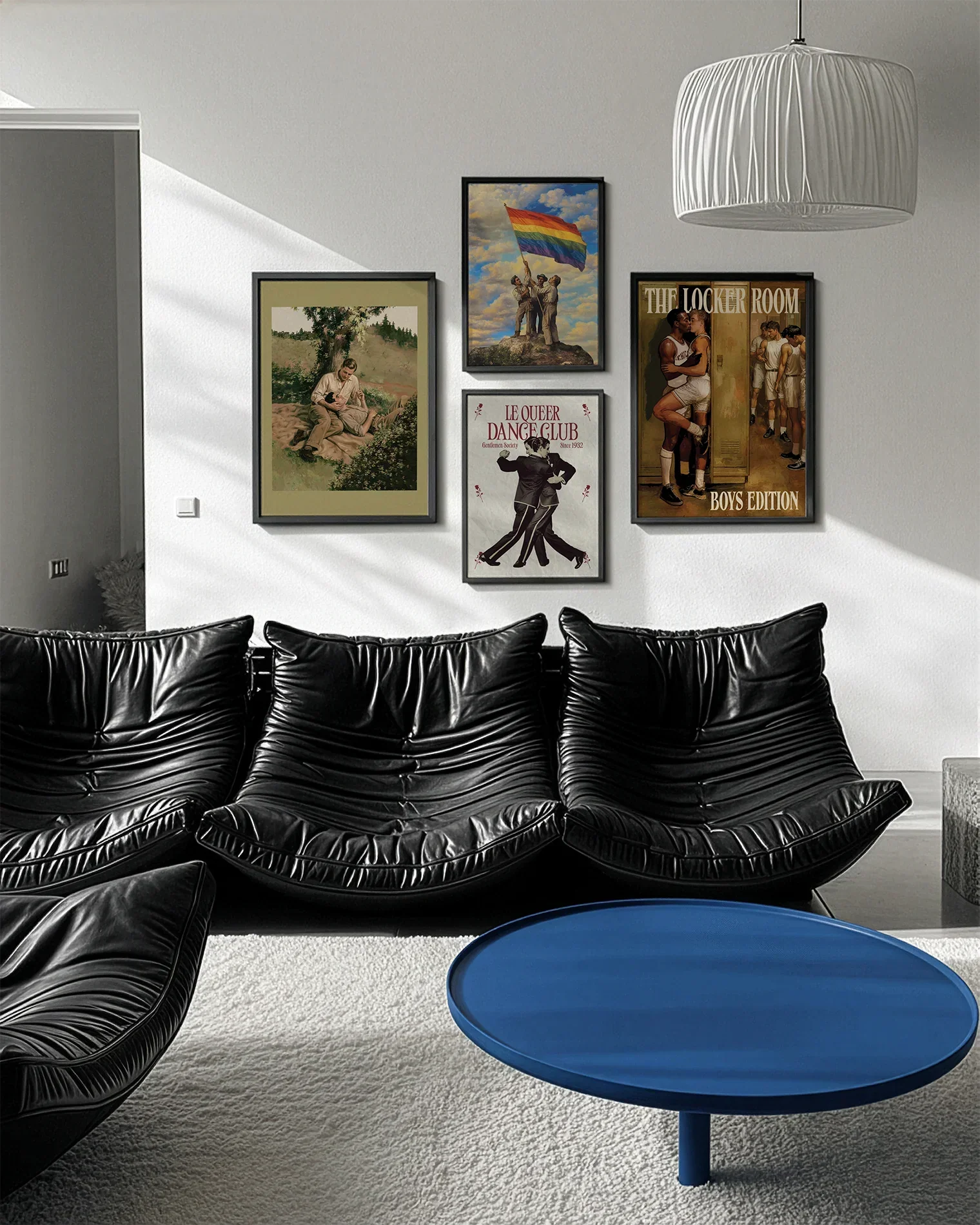 A gallery wall with several framed, queer posters in a living room.