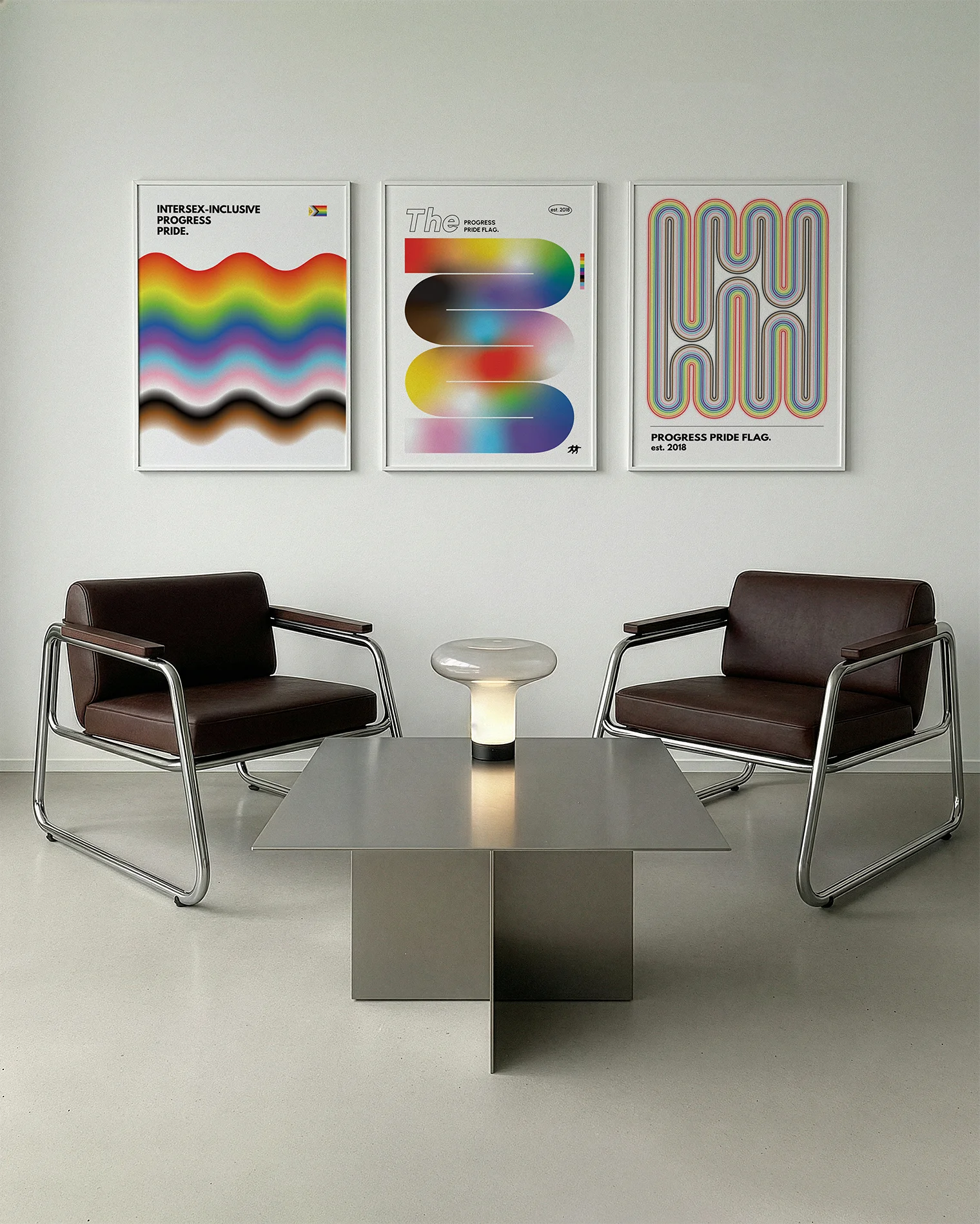 A gallery wall with several framed, queer posters in a living room.