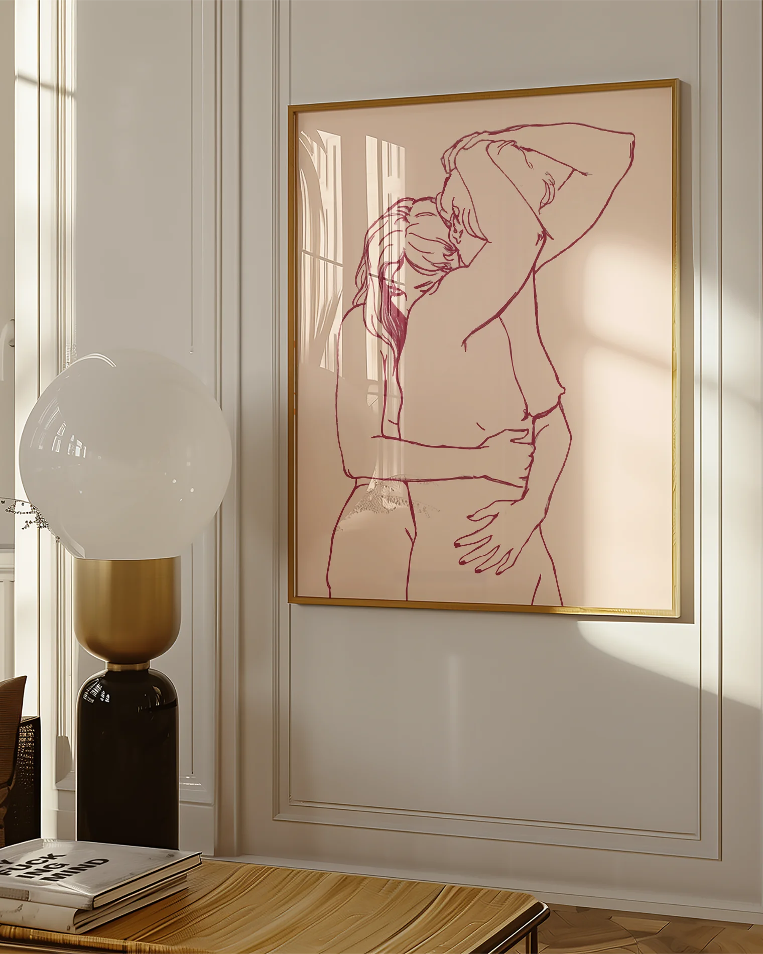 A framed print with two lesbian, naked girls hugging.