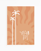 A print with an illustrated lesbian, baked couple dancing under a red sun and palms.