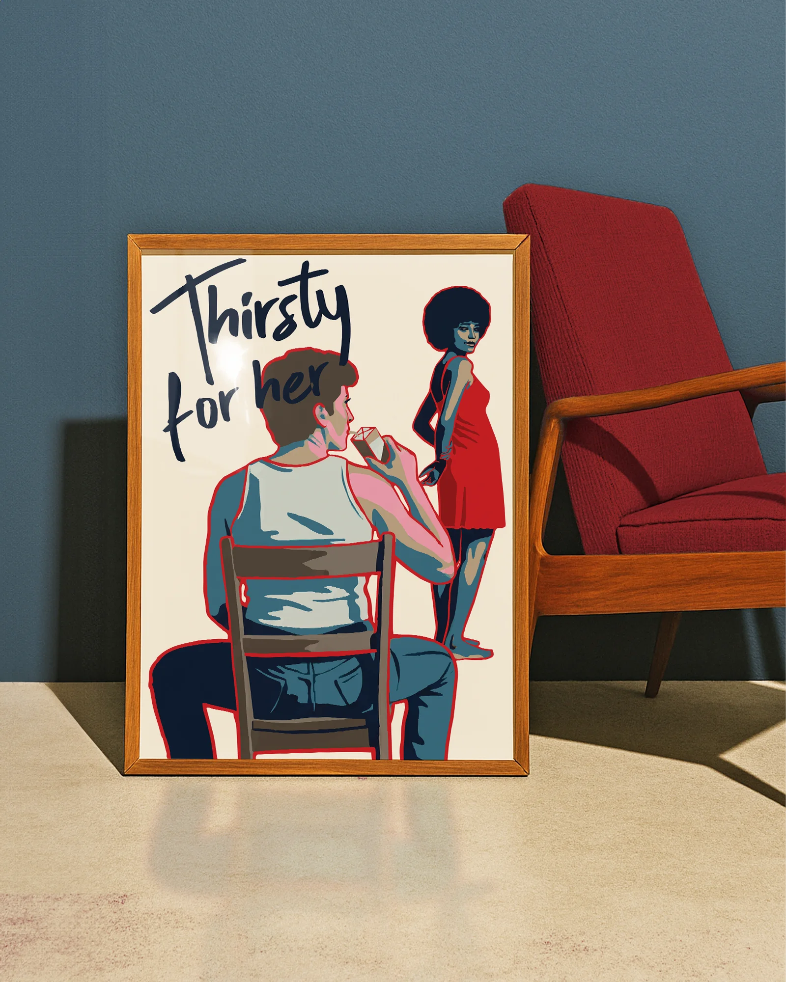 En poster som föreställer en butchflata som dricker ur en juicebox, sittandes på en stol. Framför henne står en vacker kvinna med ett sug i blicken, tillsammans med texten 'Thirsty for her'.