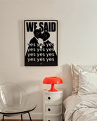 A poster with a silhouette of two men kissing with the text 'We said yes yes yes'.