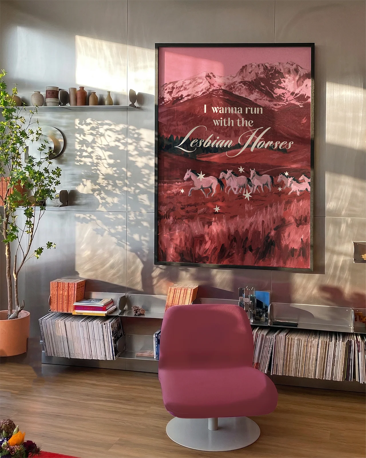 A poster with seven white horses running on an open field, with the text 'I wanna run with the lesbian horses'.